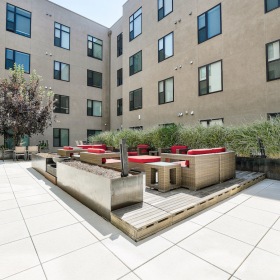 Courtyard Apartment courtyard in Denver with modern seating areas and landscaped greenery.