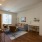 Denver apartment living room with workspace, sofa, and stylish design.