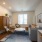 Denver apartment living room with gray sofa, blue rug, and contemporary furnishings.